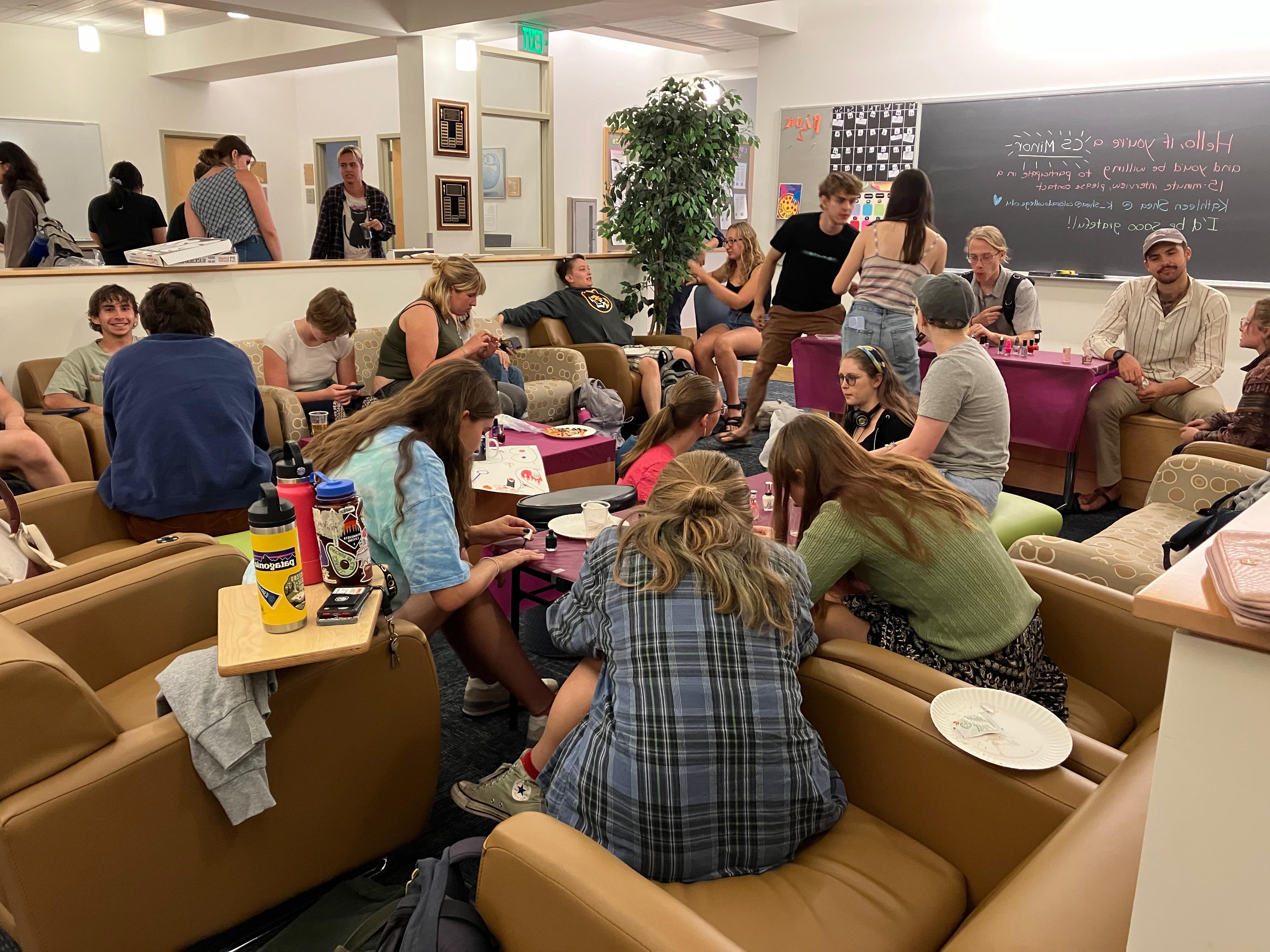 Students gathered around a common space socializing